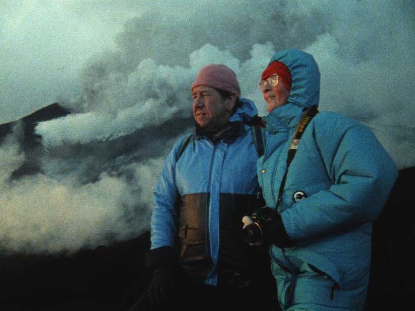 This image released by National Geographic shows Maurice Krafft, left, and Katia Krafft in a scene from the documentary "Fire of Love." (National Geographic via AP)