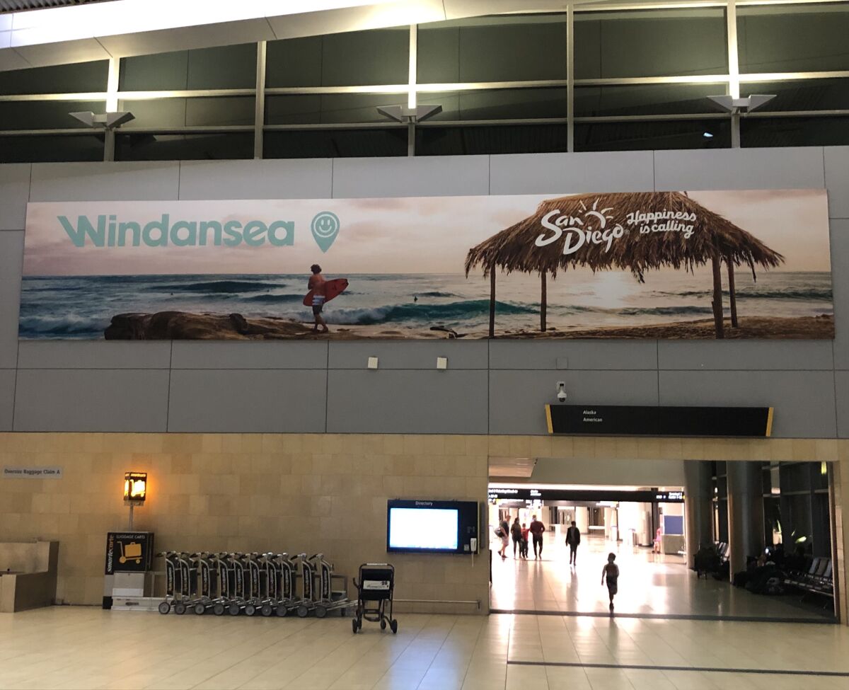 This sign at San Diego International Airport depicts La Jolla’s Windansea Beach.