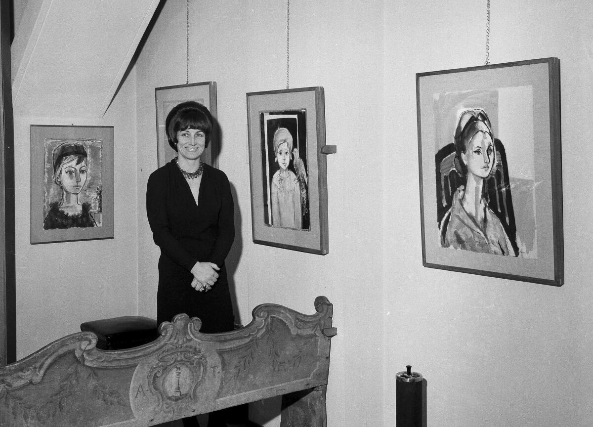 Artist Francois Gilot shows her work at an exhibition in Milan, Italy, in 1965. 