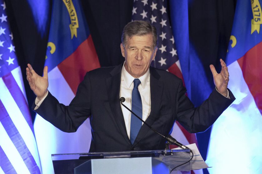 FILE - North Carolina Gov. Roy Cooper speaks at a primary election night event hosted by the North Carolina Democratic Party in Raleigh, N.C., May 17, 2022. A Medicaid expansion deal in North Carolina received final legislative approval Thursday, March 23, 2023, likely ending a decade of debate over whether the closely politically divided state should accept the federal government's coverage for hundreds of thousands of low-income adults. Cooper, a longtime expansion advocate, is expected to sign the bill, which would leave 10 states in the U.S. that have not adopted expansion. (AP Photo/Ben McKeown, File)