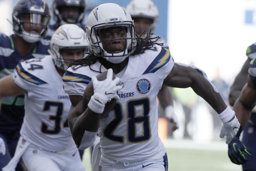 SEATTLE, WASH.. - NOV. 4, 2018. Chargers running back Melvin Gordon III leaves Seahawks defenders in his wake en route to a rouchdown in the second quarter Sunday, Nov. 4, 2018, at Century Link Field in Seattle. (Luis Sinco/Los Angeles Times)