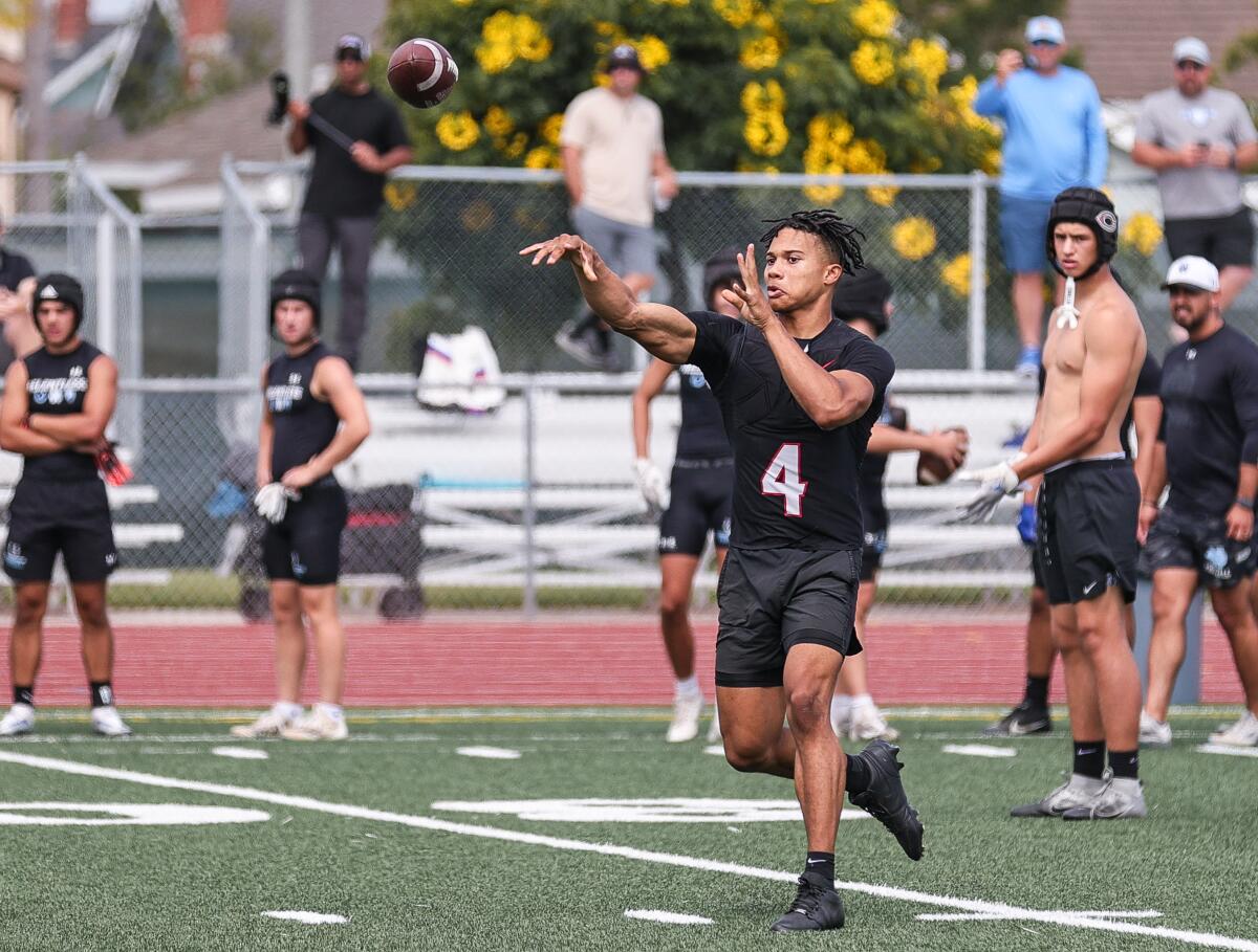 Corona Centennial High quarterback Husan Longstreet throws a pass.