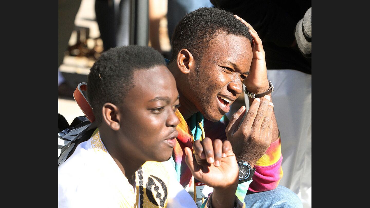 Team leader Ramadhan Daud, with teammate Salim Mauled, looks up after having his head in his hands with trepidation before his team's invention is put to the test at JPL's annual Invention Challenge on Friday, December 2, 2016. 28 teams, including a team from Tanzania, but mostly of local Southern California schools, competed. The challenge was to transfer a specific amount of water over a distance to a collection cup on the other side. Methods included catapults, conveyor belts, a lot of duct tape, and pvc.