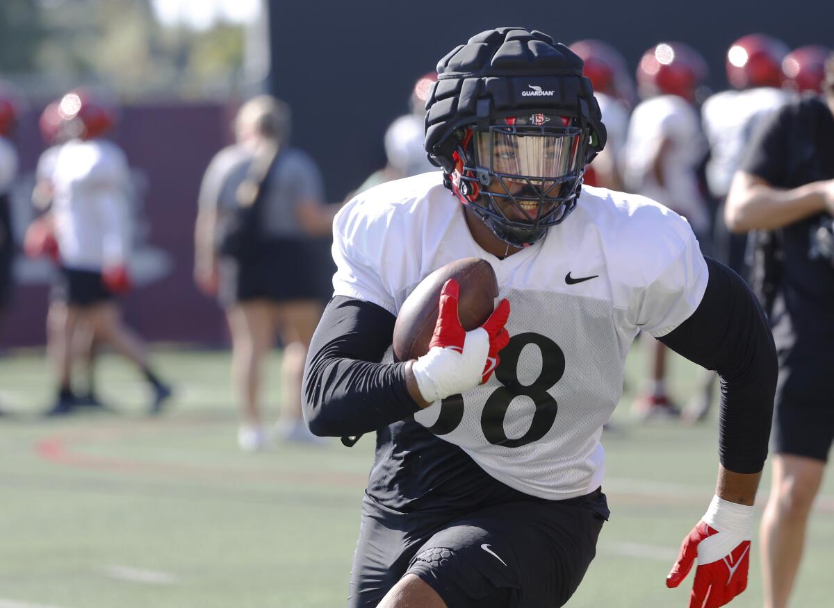 San Diego State defensive lineman Brandon McElroy, a transfer from Marshall, runs a drill during Thursday's practice.