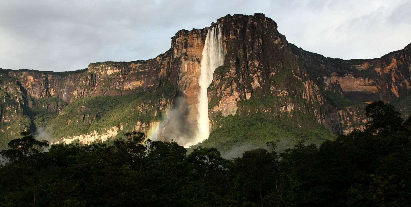Angel Falls, the world's highest waterfall plunges 3,212 feet from the top of Auyan-Tepui (Devil's Mountain) to the Churun River in eastern Venezuela. The waterfall, located in Canaima National Park, is named after James Angel, an American aviator who flew over the falls in 1933. More photos...
