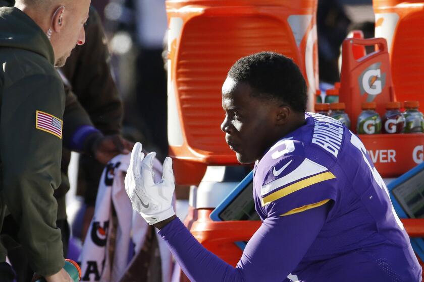 Vikings quarterback Teddy Bridgewater sits on the bench after taking a hit to the helmet during the second half of a game against the St. Louis Rams on Sunday in Minneapolis.
