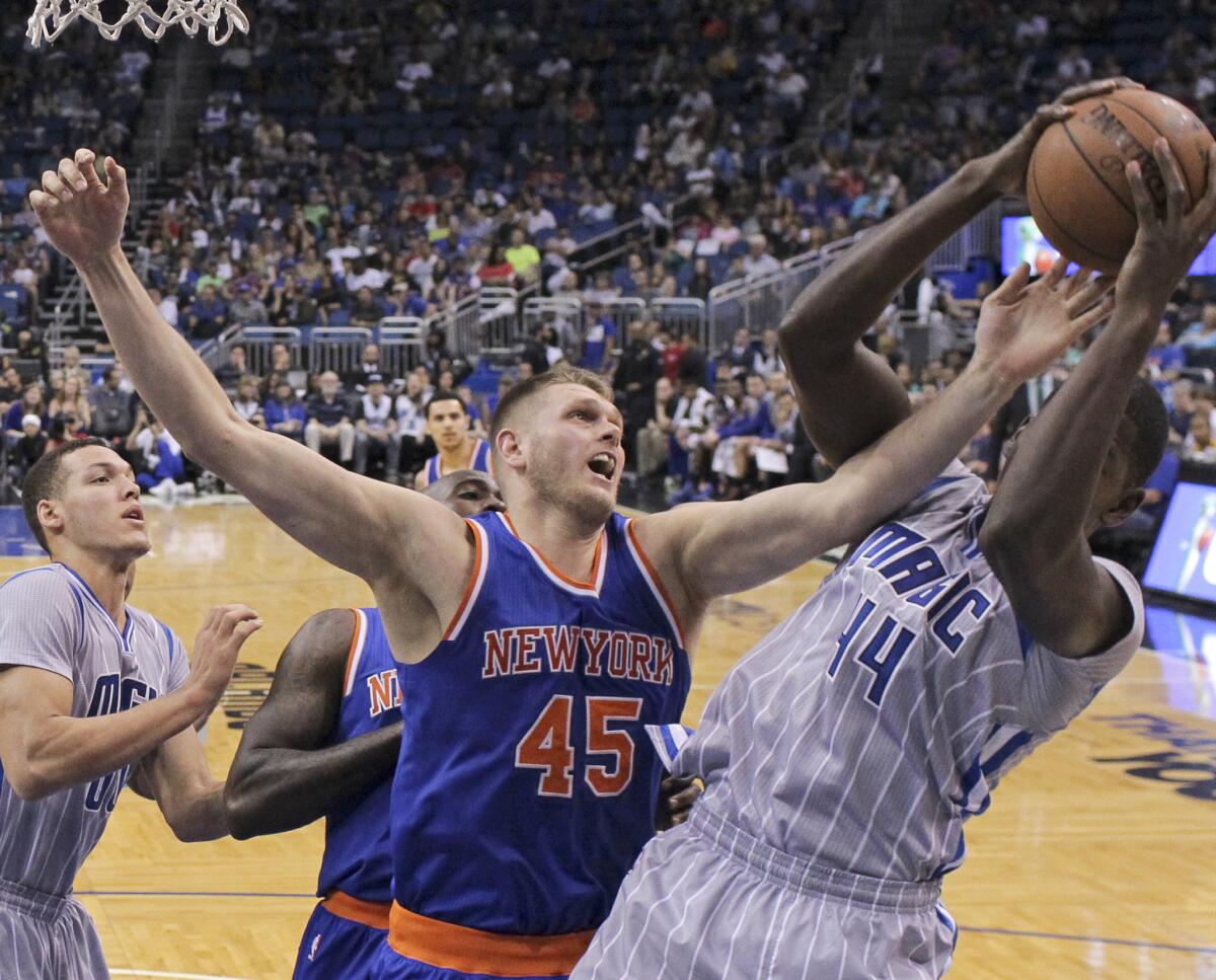 Knicks center Cole Aldrich (45) battles with Magic forward Andrew Nicholson for a rebound.