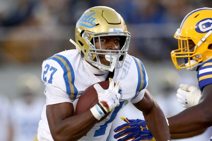 BERKELEY, CA - OCTOBER 13: Joshua Kelley #27 of the UCLA Bruins runs with the ball against the California Golden Bears at California Memorial Stadium on October 13, 2018 in Berkeley, California. (Photo by Ezra Shaw/Getty Images) ** OUTS - ELSENT, FPG, CM - OUTS * NM, PH, VA if sourced by CT, LA or MoD **