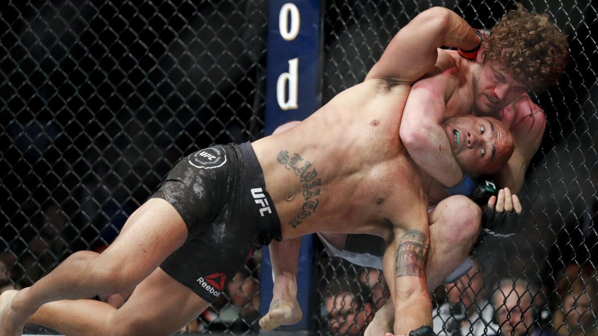 Ben Askren chokes Robbie Lawler in a welterweight bout at UFC 235.