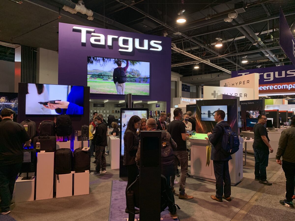 Attendees at the first day of CES 2023 in Las Vegas gather near the Targus booth.