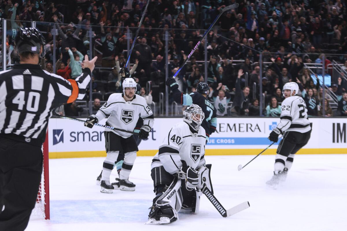 Kings players, including Cal Petersen (40), react after the Kraken's Jordan Eberle (7) scored in overtime Nov. 19, 2022.