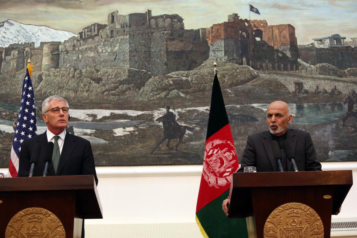 Secretary of Defense Chuck Hagel, left, appears at a joint news conference with Afghan President Ashraf Ghani in Kabul, Afghanistan, on Saturday.