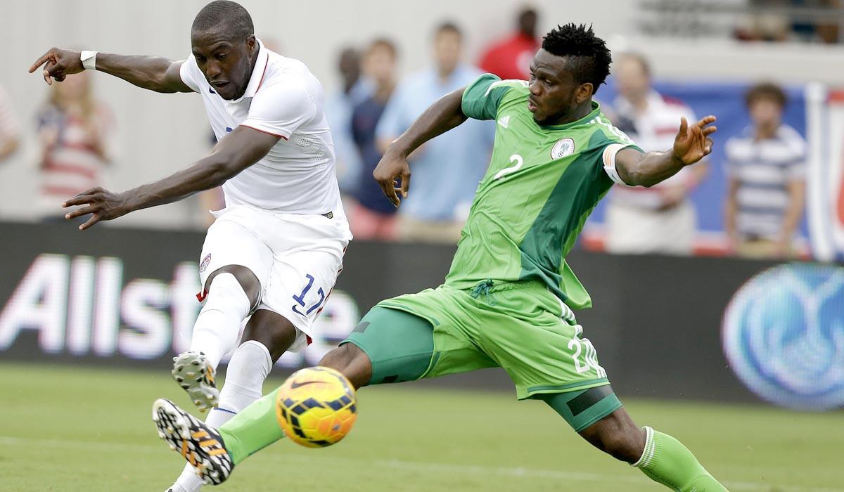 U.s. forward Jozy Altidore scores on a shot past Nigeria defender Joseph Yobo in the first half of a World Cup tuneup game on Saturday in Jacksonville, Fla.