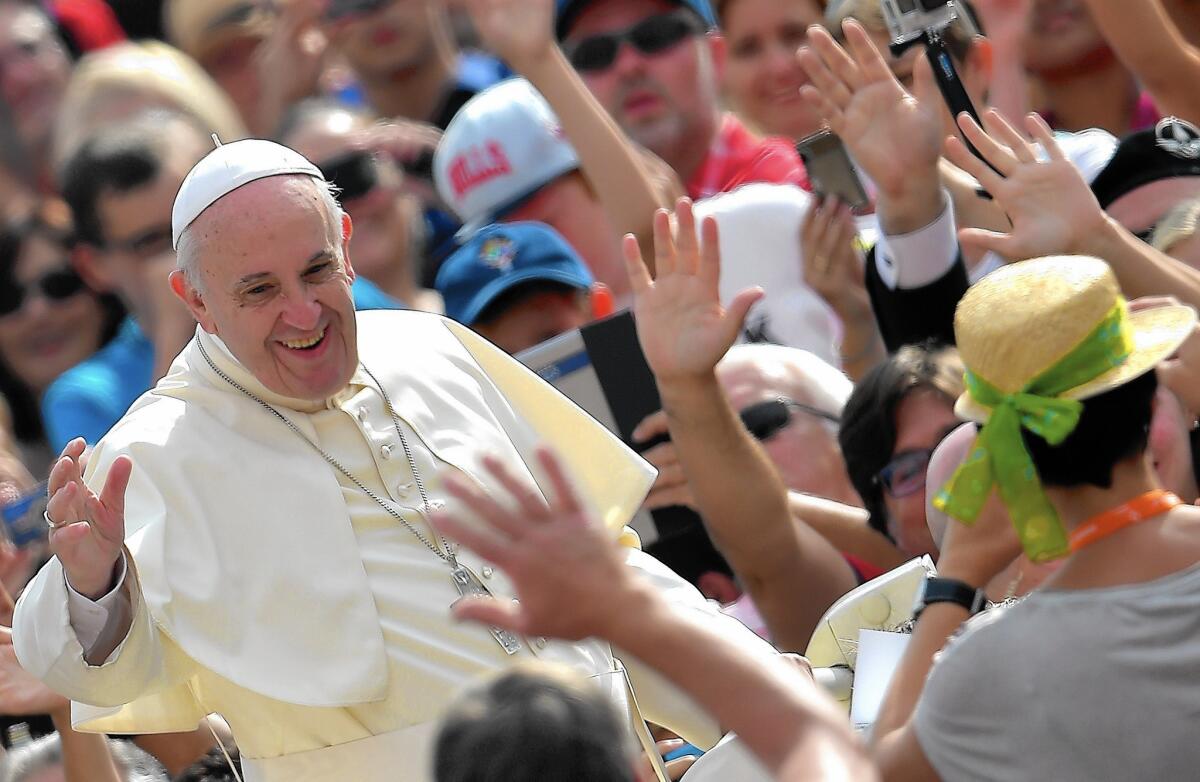 Pope Francis greets a crowd in St. Peter's Square on Sept. 2. He visits the U.S. on Sept. 22-27.