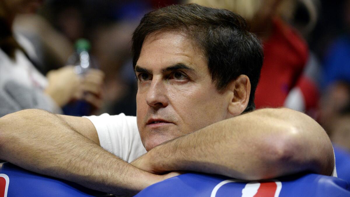 Mavericks owner Mark Cuban watches a game against the Clippers from the edge of his seat at Staples Center on Oct. 29.