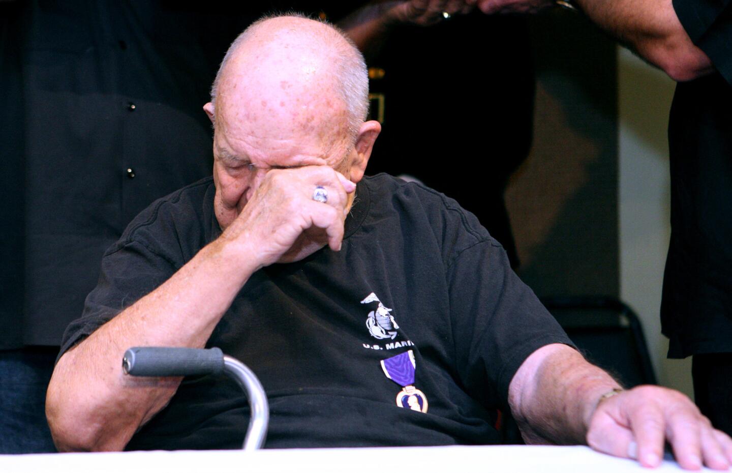 Retired United States Marine Corps Corporal Samuel Leland Anderson, Jr., 91 of Woodland Hills, wipes tears after receiving the Purple Heart during ceremony at Henri's Coffee Shop in Canoga Park on Thursday, Feb. 9, 2017. Anderson Jr., who was wounded on March 11, 1945, after 21 days of intense fighting at Iwo Jima, Japan, during World War II, is the father of retired Glendale police Lt. Todd Anderson.