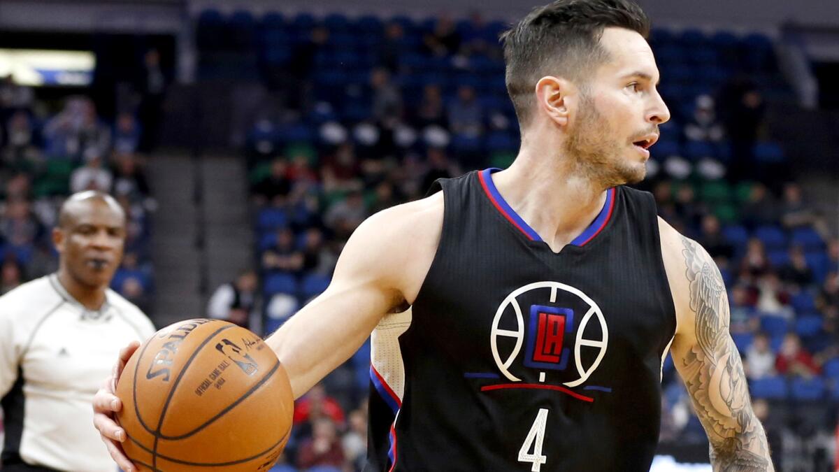Clippers guard J.J. Redick brings the ball up court against the Minnesota Timberwolves during the second half.