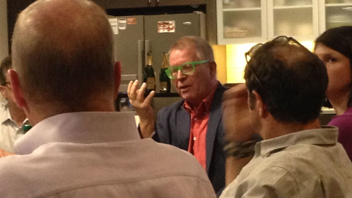 Peter Fink (in green glasses) discusses ideas for San Diego at the AVRP Skyport Studios architectural office.