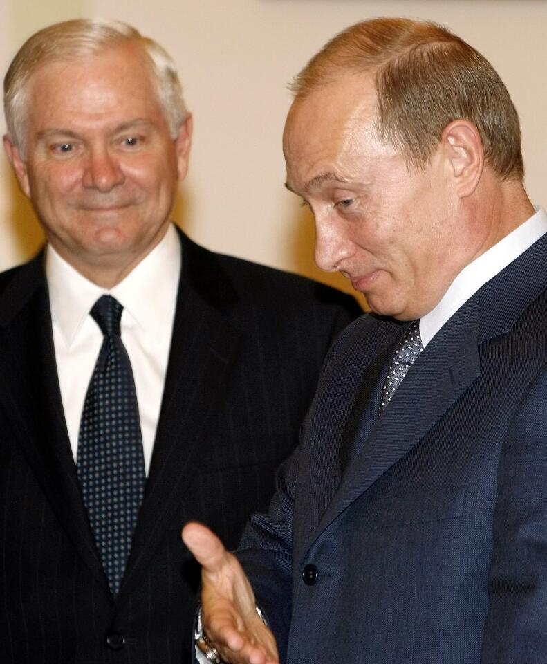 Robert Gates and Russian President Vladimir Putin