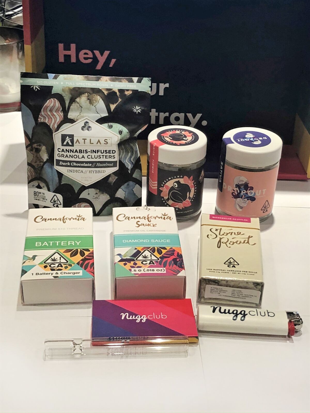 A display of five cannabis products and some smoking accoutrements from the June Nugg Club subscription box.