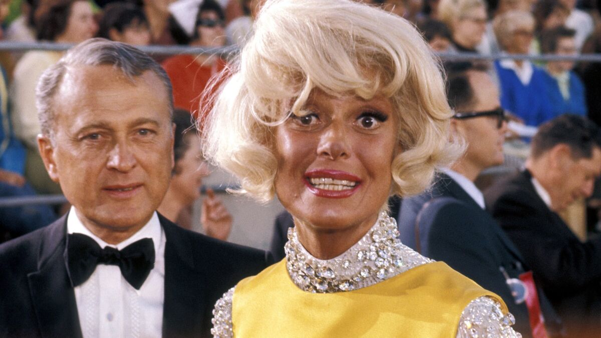 Carol Channing, arriving with Charles Lowe to the 1968 Academy Awards at the Dorothy Chandler Pavilion in Los Angeles.