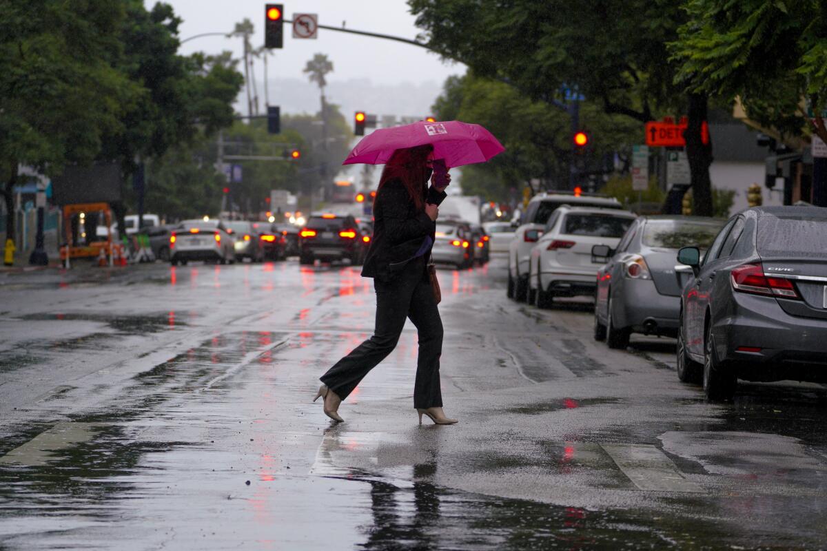 Crystal Castro made her way through Little Italy during a downpour last Tuesday.