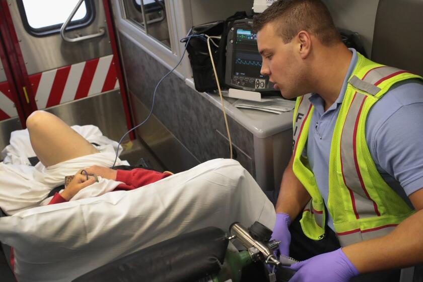 ROCKFORD, IL - JULY 14: Firefighter Tyler Behrends treats an overdose victim as she is transported to a hospital on July 14, 2017 in Rockford, Illinois. The woman was found on the floor of the hotel room where she lived after taking an overdose of prescription medication and alcohol. Rockford, a city of about 150,000 located in northern Illinois, averages about 2 overdose deaths per week, most which are heroin related. Nationwide, an estimated 60,000 people in the U.S. died from drug overdoses in 2016, more than gunshots or traffic accidents. (Photo by Scott Olson/Getty Images) ** OUTS - ELSENT, FPG, CM - OUTS * NM, PH, VA if sourced by CT, LA or MoD **