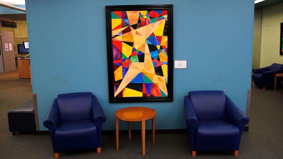 One of Chip Fesko's abstract geometric paintings, "Orthogonal lines to nowhere," is on display at the Newport Beach Central Library.
