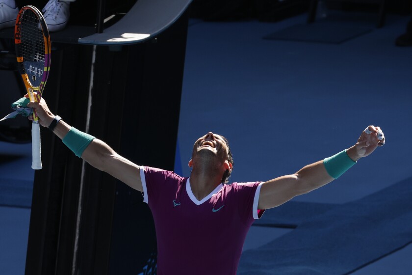 Rafael Nadal of Spain celebrates after defeating Adrian Mannarino of France in their fourth round match at the Australian Open tennis championships in Melbourne, Australia, Sunday, Jan. 23, 2022. (AP Photo/Hamish Blair)