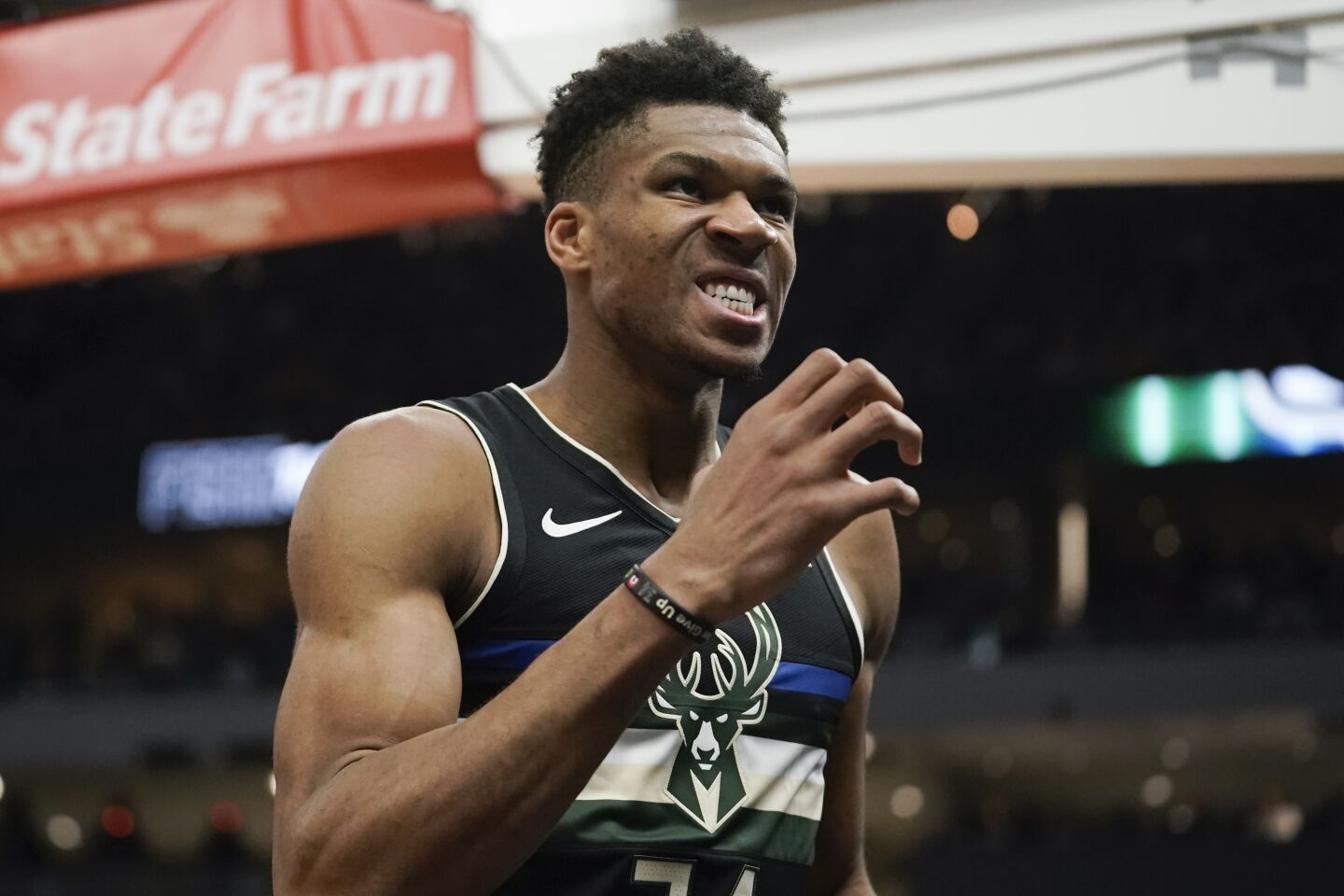 Giannis Antetokounmpo reacts after making a basket and getting fouled during the second half of a game against the Lakers on Dec. 19.