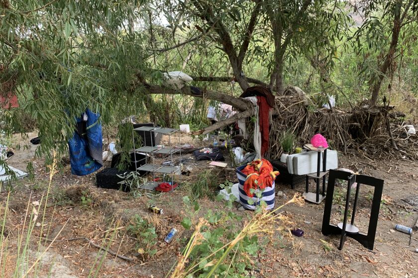 A homeless encampment in Santee by the San Diego River on Aug. 19, 2022.