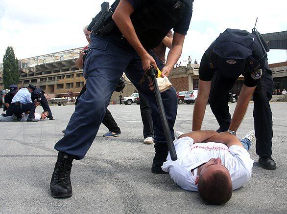 Police officers arrest members of the ethnic Albanian activist group Vetevendosja who vandalized dozens of vehicles belonging to the European Union's mission in Kosovo's capital. Vetevendosja (or Self-Determination) opposes what it considers international interference in Kosovo.