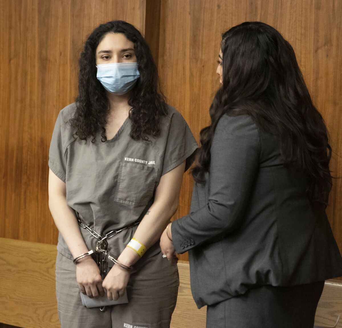 Jacqueline West, left, stands at her arraignment with attorney Alekxia Torres-Stallings in Kern County Superior Court in Bakersfield, Calif., Thursday, March 3, 2022. Jacqueline and Trezell West, the adoptive parents of two small California boys who were reported missing in 2020, have been charged with killing the children, although their bodies have not been found. (Rodney Thornburg/The Bakersfield Californian via AP)