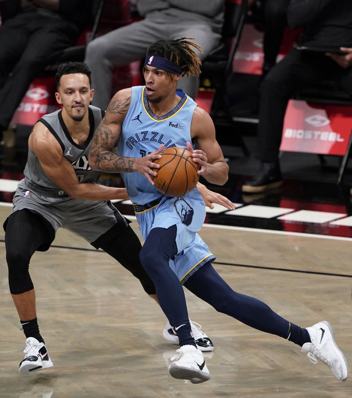 Brooklyn Nets guard Landry Shamet defends against Memphis Grizzlies guard Ja Morant.