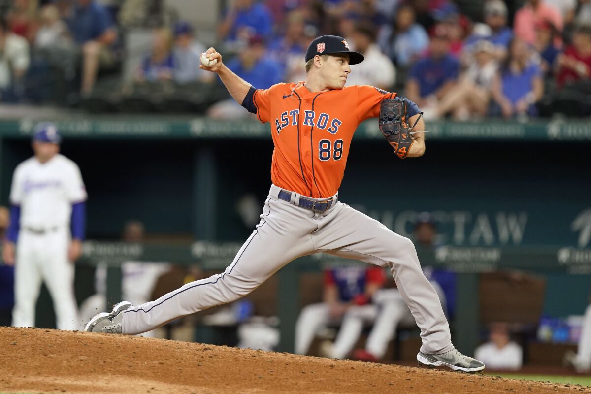 Houston Astros relief pitcher Phil Maton throws during the seventh inning of a baseball game against the Texas Rangers in Arlington, Texas, Wednesday, June 15, 2022. The Astros won 9-2. (AP Photo/LM Otero)