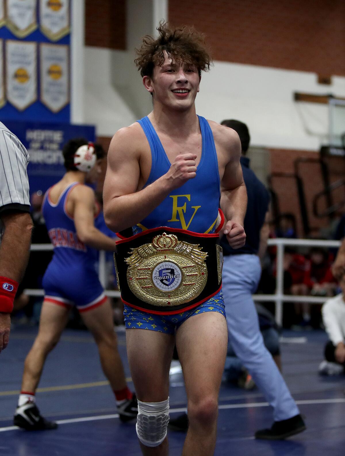 Fountain Valley's Justin Rodriguez is all smiles after beating St. John Bosco's Grigor Cholakyan in the 126-pound final.