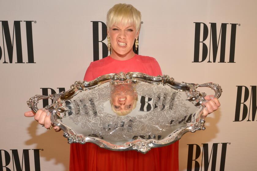 P!nk poses with the BMI President's Award during the 63rd Annual BMI Pop Awards held at the Beverly Wilshire Hotel.