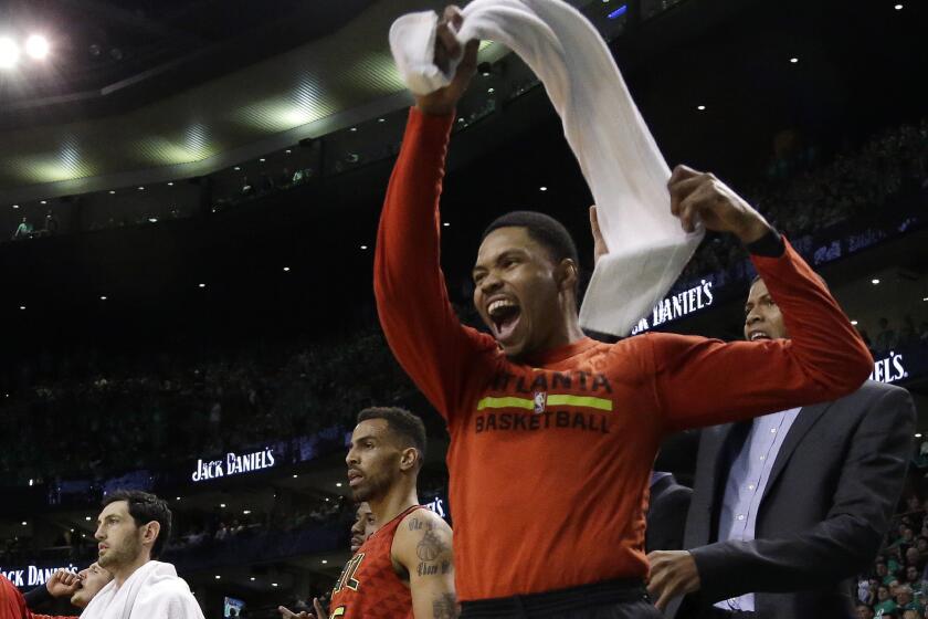 Hawks forward Kent Bazemore cheers from the bench during the third quarter against the Celtics in Game 6.