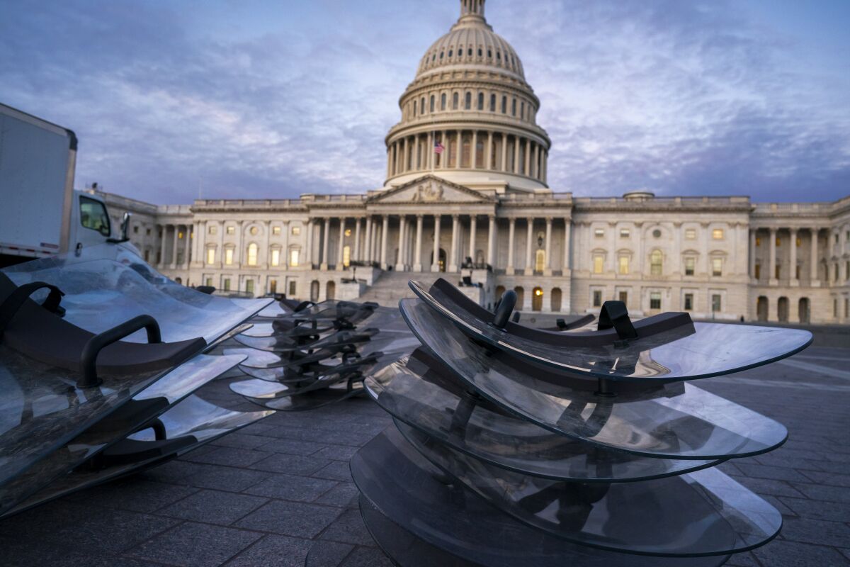 Riot shields are stacked at the ready as National Guard troops reinforce the security zone on Capitol Hill.