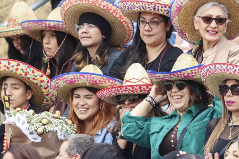Family members and friends cheer on the graduates during a graduation ceremony at Southwestern College on Friday, May 26, 2023.