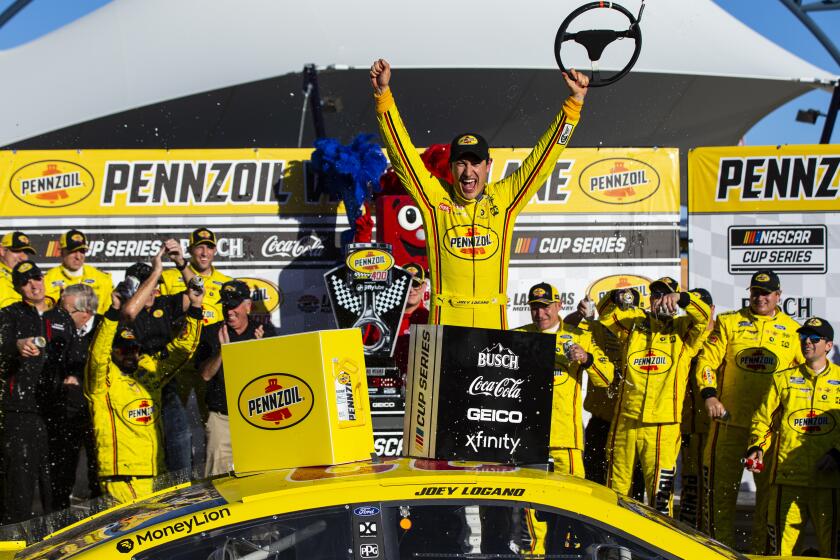 Joey Logano celebrates after winning a NASCAR Cup Series auto race at the Las Vegas Motor Speedway on Sunday, Feb. 23, 2020. (AP Photo/Chase Stevens)