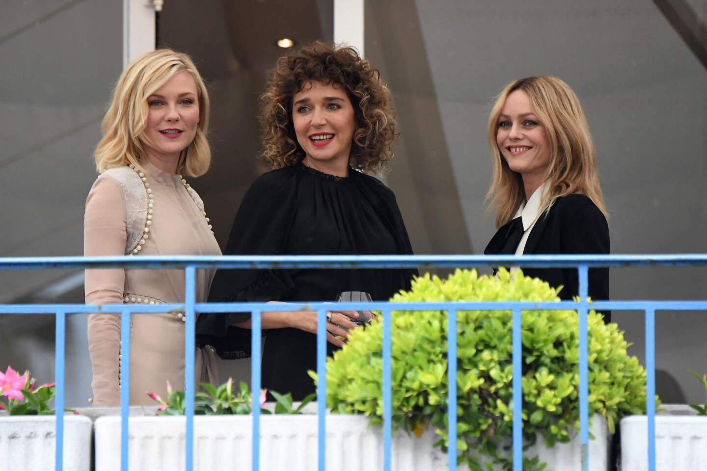 Jury members actress Kirsten Dunst, left, actress and director Valeria Golino and actress and singer Vanessa Paradis on the balcony at the Grand Hyatt Cannes Hotel Martinez.