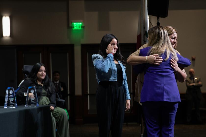San Diego, California - April 29: Summer Stephan, San Diego County District Attorney, right, hugs Natalie Ortiz during the Citizens of Courage event on Monday, April 29, 2024 in San Diego, California. The event recognized six individuals who showed courage during crime incidents. (Ana Ramirez / The San Diego Union-Tribune)