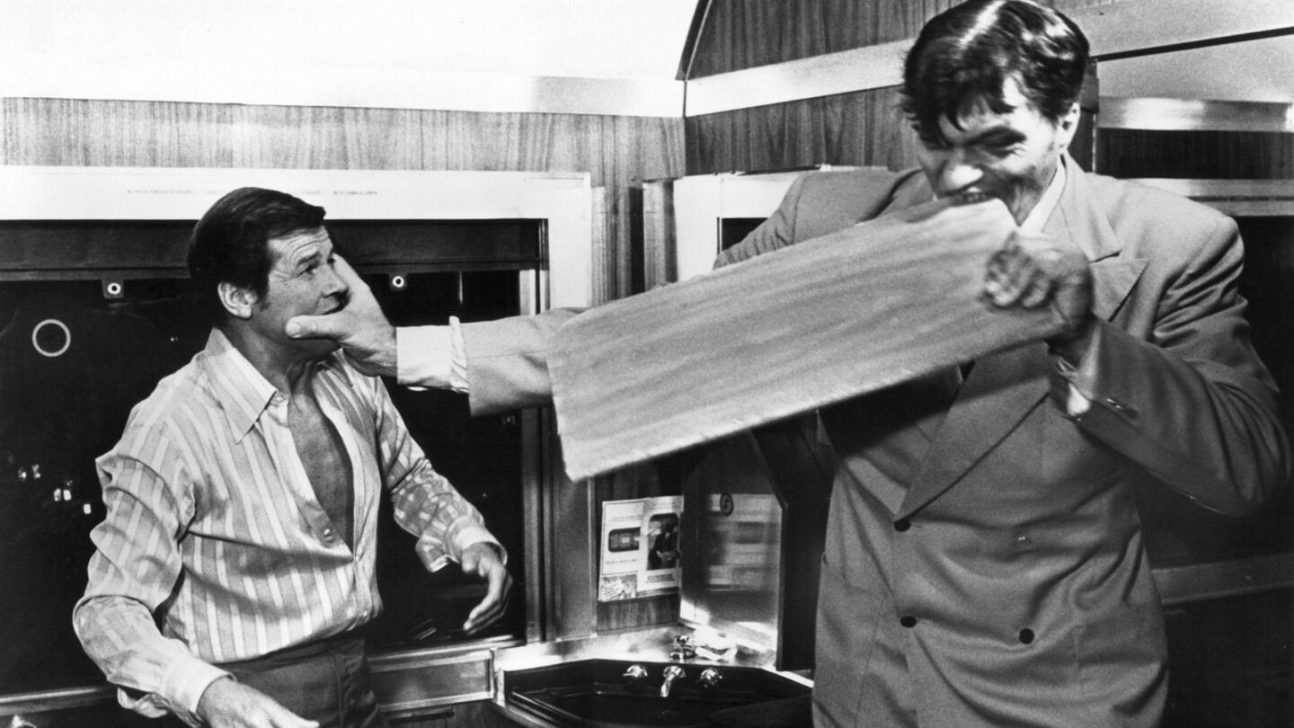 Roger Moore, left, was back as Bond again in "The Spy Who Loved Me," here taking on Jaws (Richard Kiel).