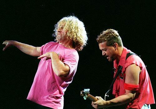 After the departure of David Lee Roth, the second generation of Van Halen featured Sammy Hagar, left, on vocals and a poppier, more radio-friendly sound. Shown here at 1995 concert, this version of Van Halen scaled new heights in sales, but some fans derisively refer to this era of the band as "Van Hagar."
