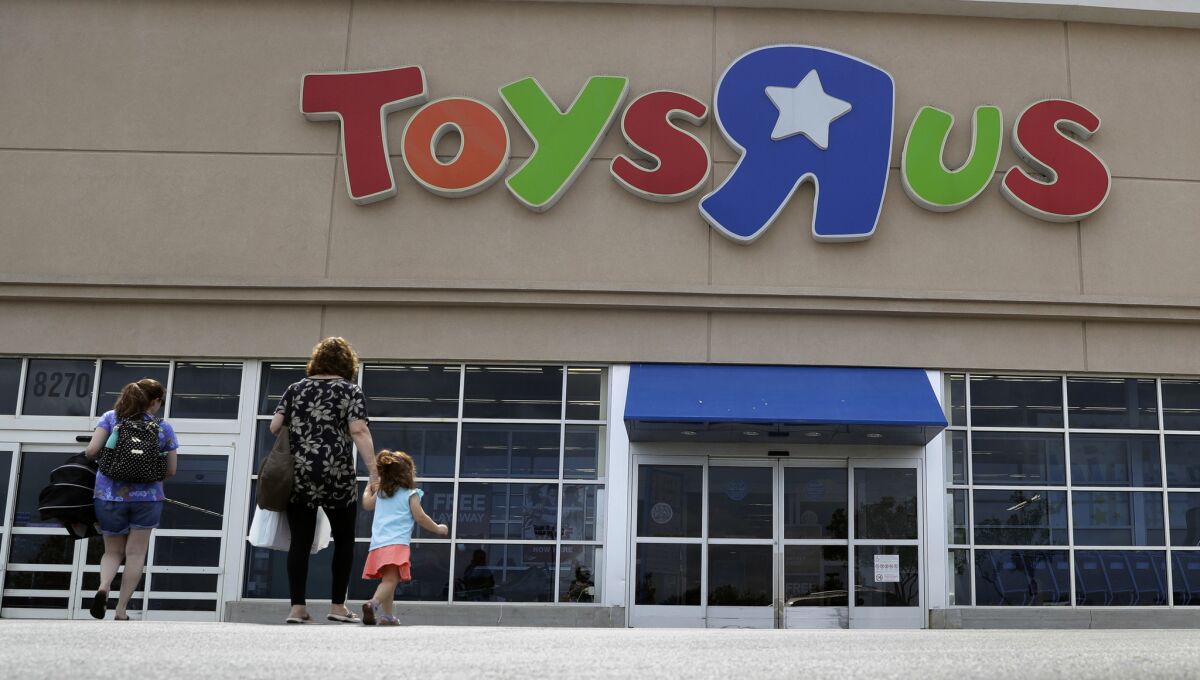 Shoppers walk into a Toys R Us store in San Antonio.