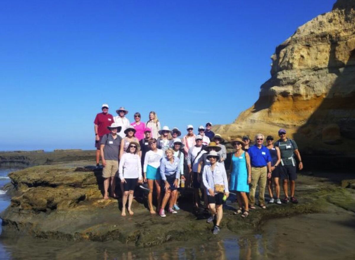 La Jolla Newcomers Club members traverse La Jolla Shores at low tide.