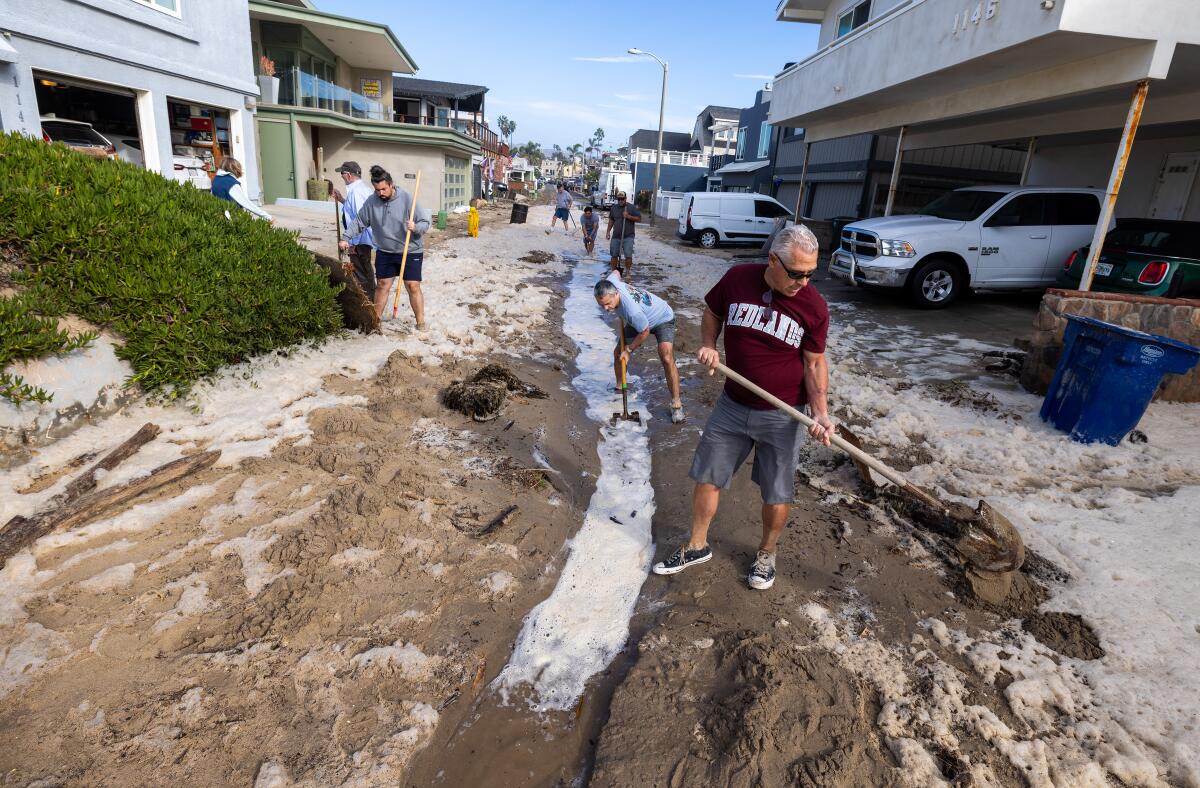 Neighbors shovel mud in Ventura.