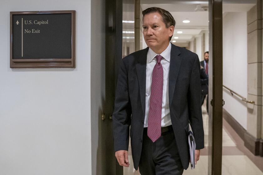 FILE - In this Oct. 4, 2019, file photo, Michael Atkinson, the inspector general of the intelligence community, arrives at the Capitol in Washington for closed-door questioning about a whistleblower complaint that triggered President Donald Trump's impeachment. Trump has fired Atkinson. Trump informed the Senate intelligence committee Friday, April 3, 2020, of his decision to fire Atkinson, according to a letter obtained by The Associated Press. (AP Photo/J. Scott Applewhite, File)