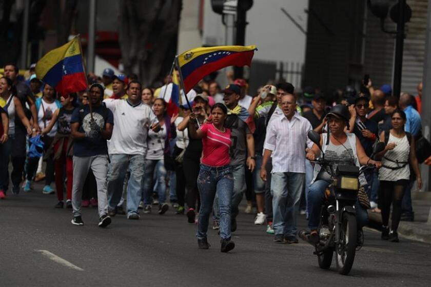 People demonstrate against the government of President Nicolas Maduro in Caracas, Venezuela, 23 January 2019. EFE-EPA/Miguel Gutierrez